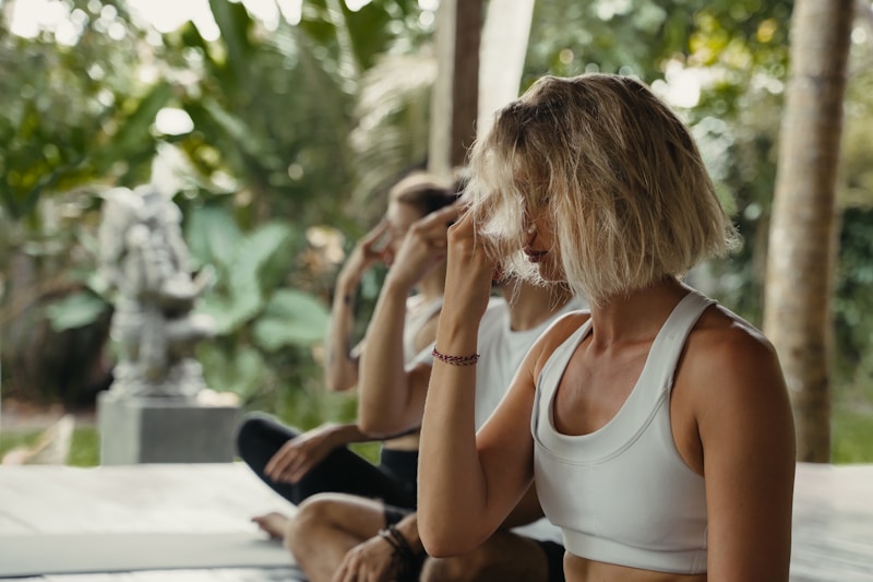 Group breathwork session outdoors - guided conscious breathing in a calm tropical setting